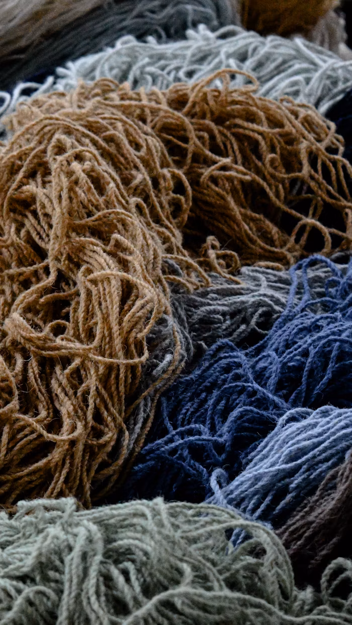 Blue, green. grey and green colours of Worsted Yarn